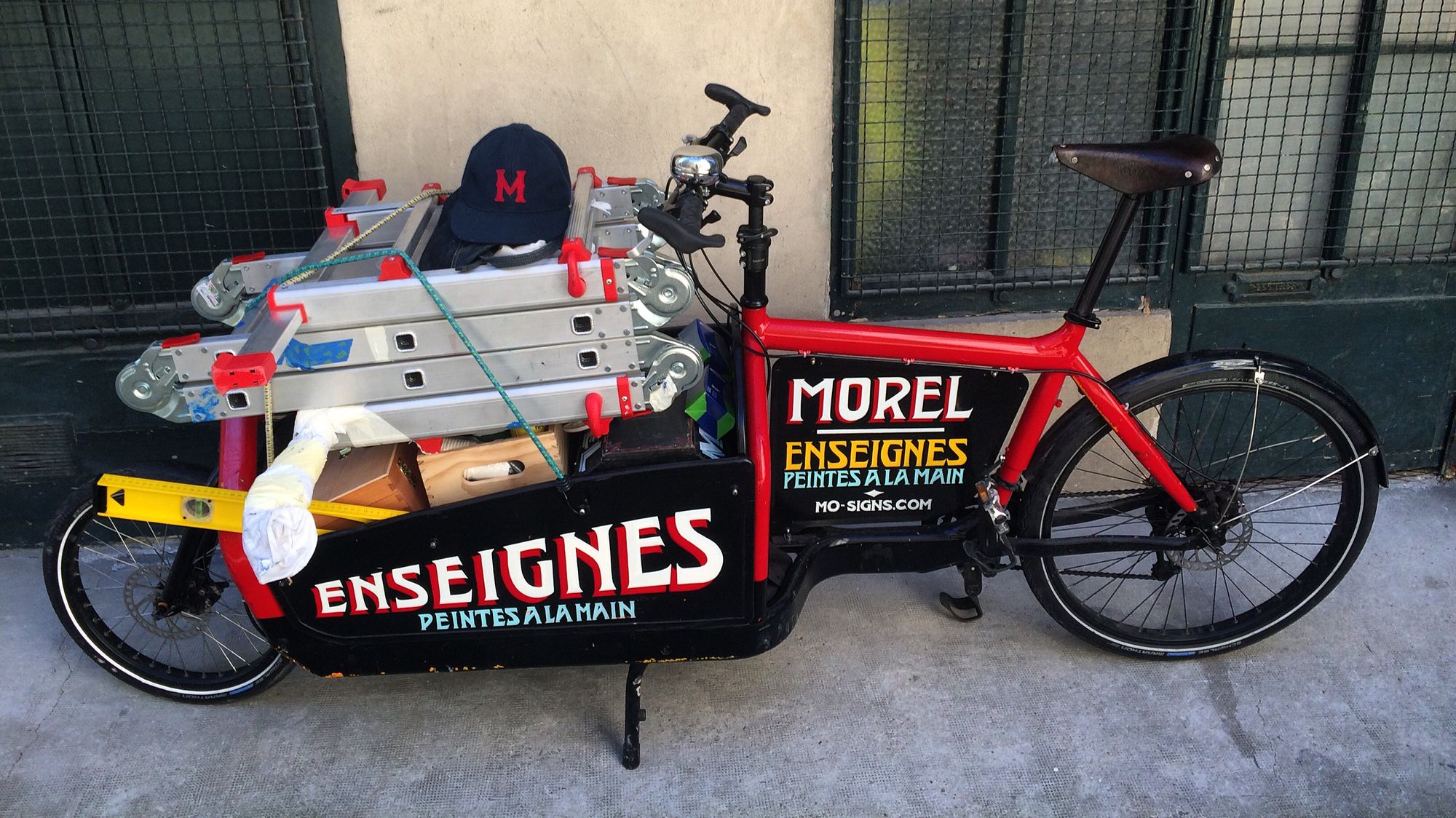 Cargo bike with painted signs on it.
