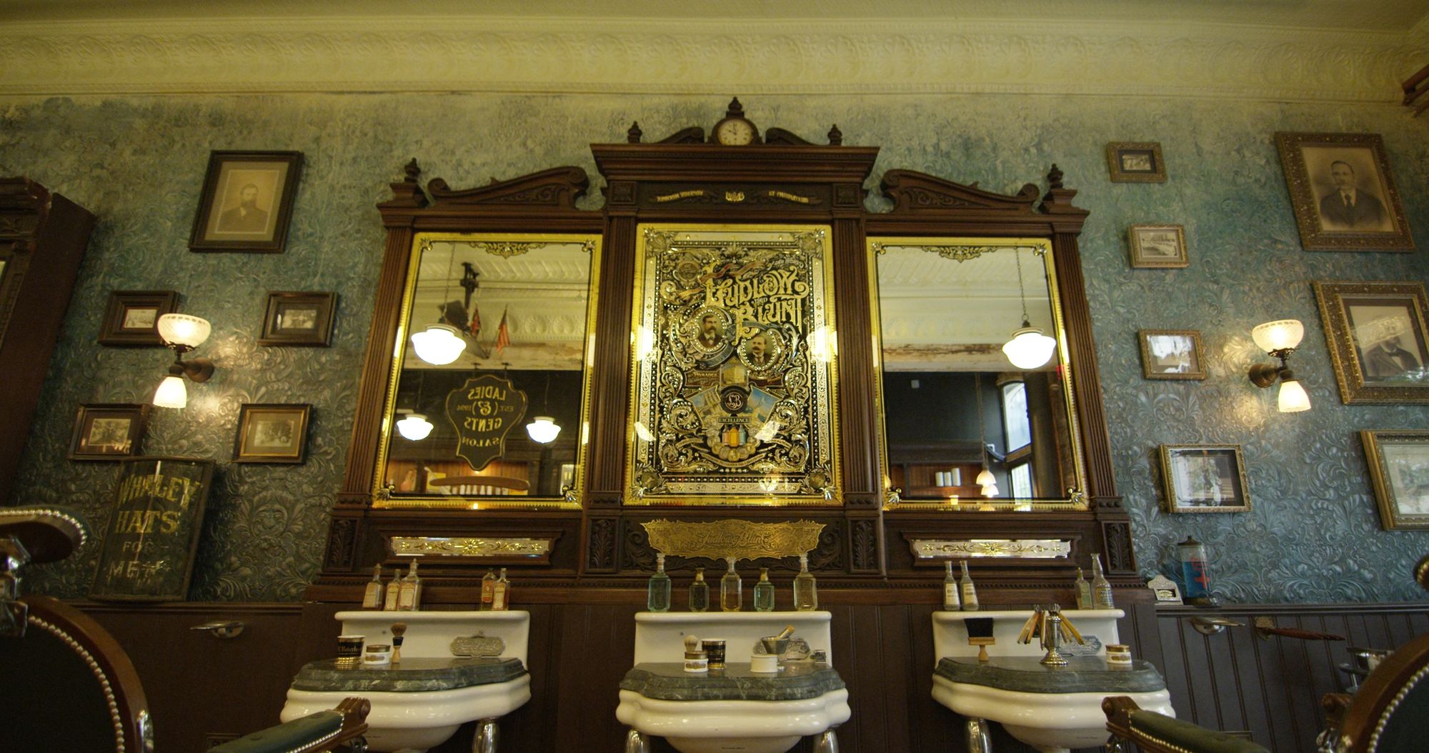 Chairs, sinks and mirrors in a barber's salon.