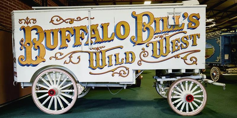 Wagon painted white with gold and blue lettering.