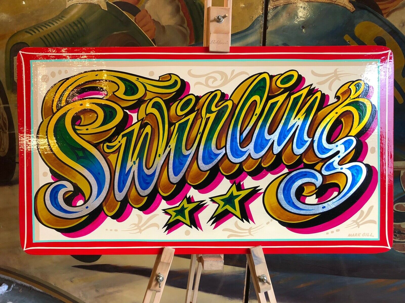 'Swirling' painted in fairground lettering style.