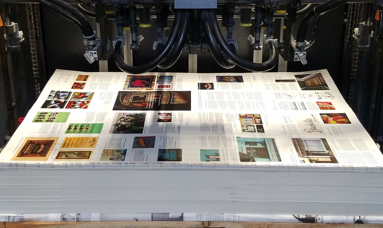 Pile of paper on a printing press.
