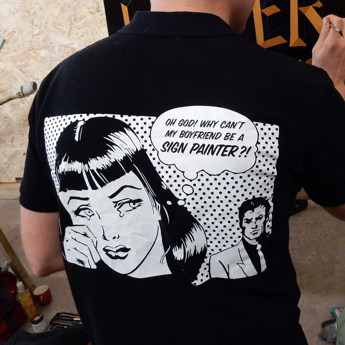 T-shirt in Pop Art style with picture of a woman crying saying "Oh God! Why can't my boyfriend be a sign painter?!"
