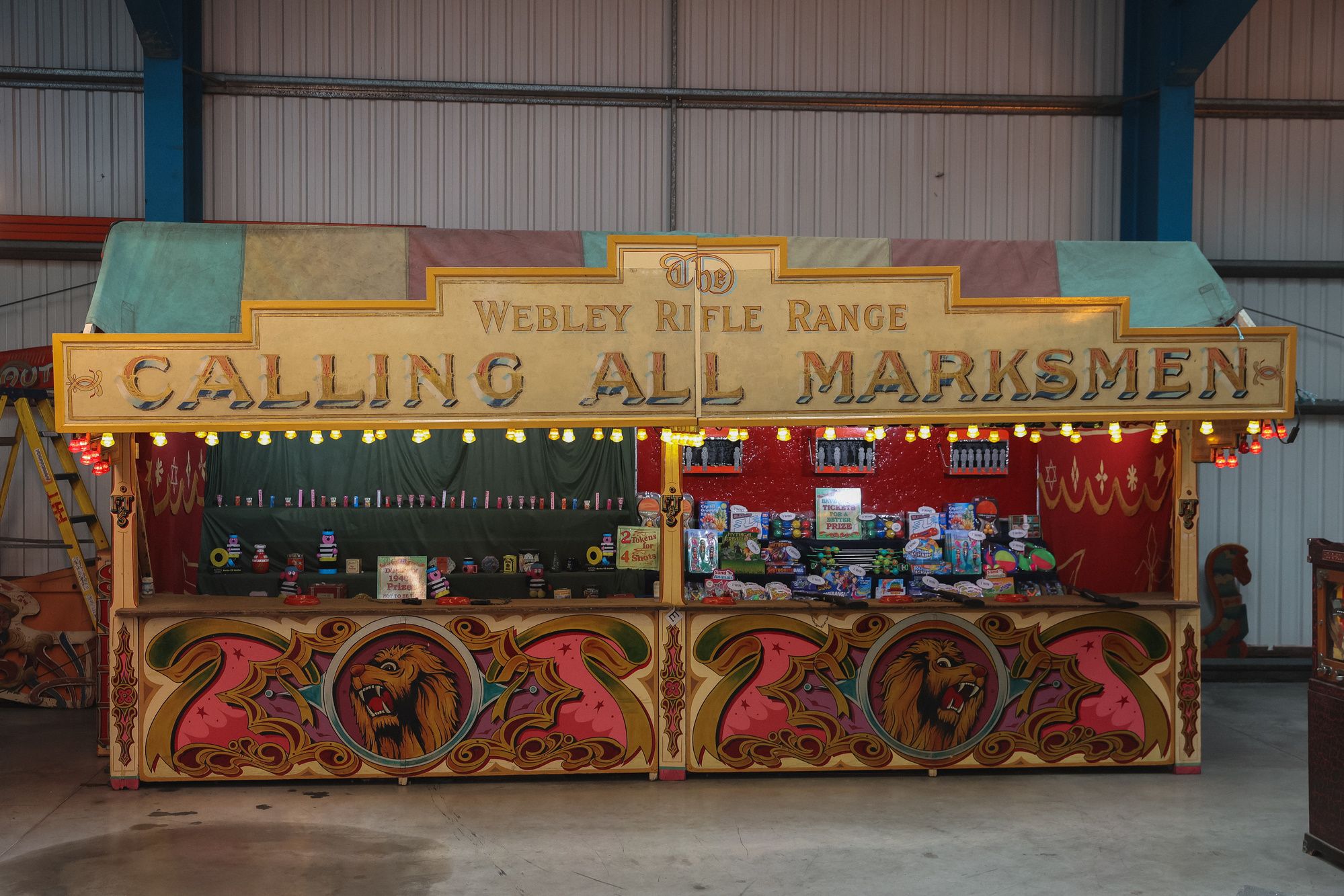Vintage fairground shooting saloon stall.