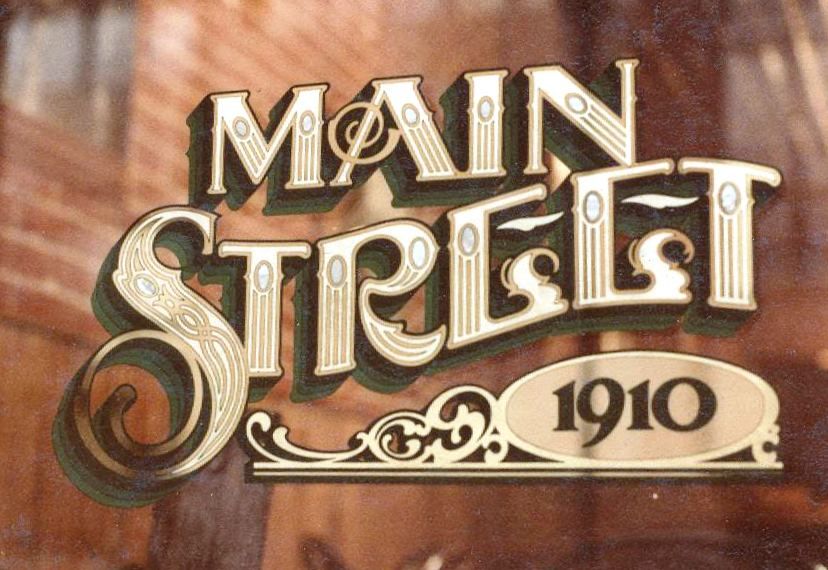 Gilded glass sign reading 'Main Street 1910'.