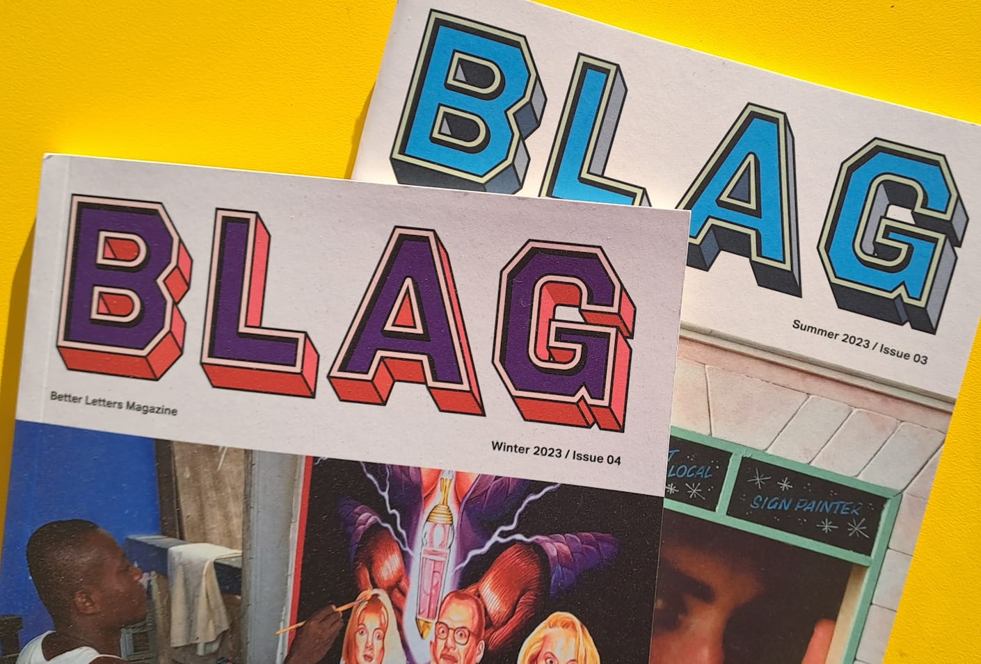 Two issues of a magazine with the masthead BLAG above sign painting-related photography.