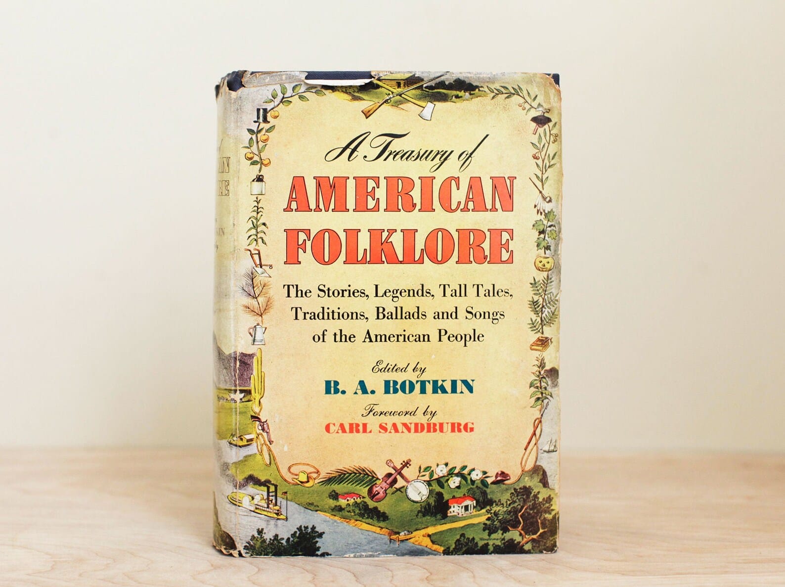 Book cover with the title, subtitle and contributor details in a central panel surrounding by an illustration of rural/rustic scenery and scenes.
