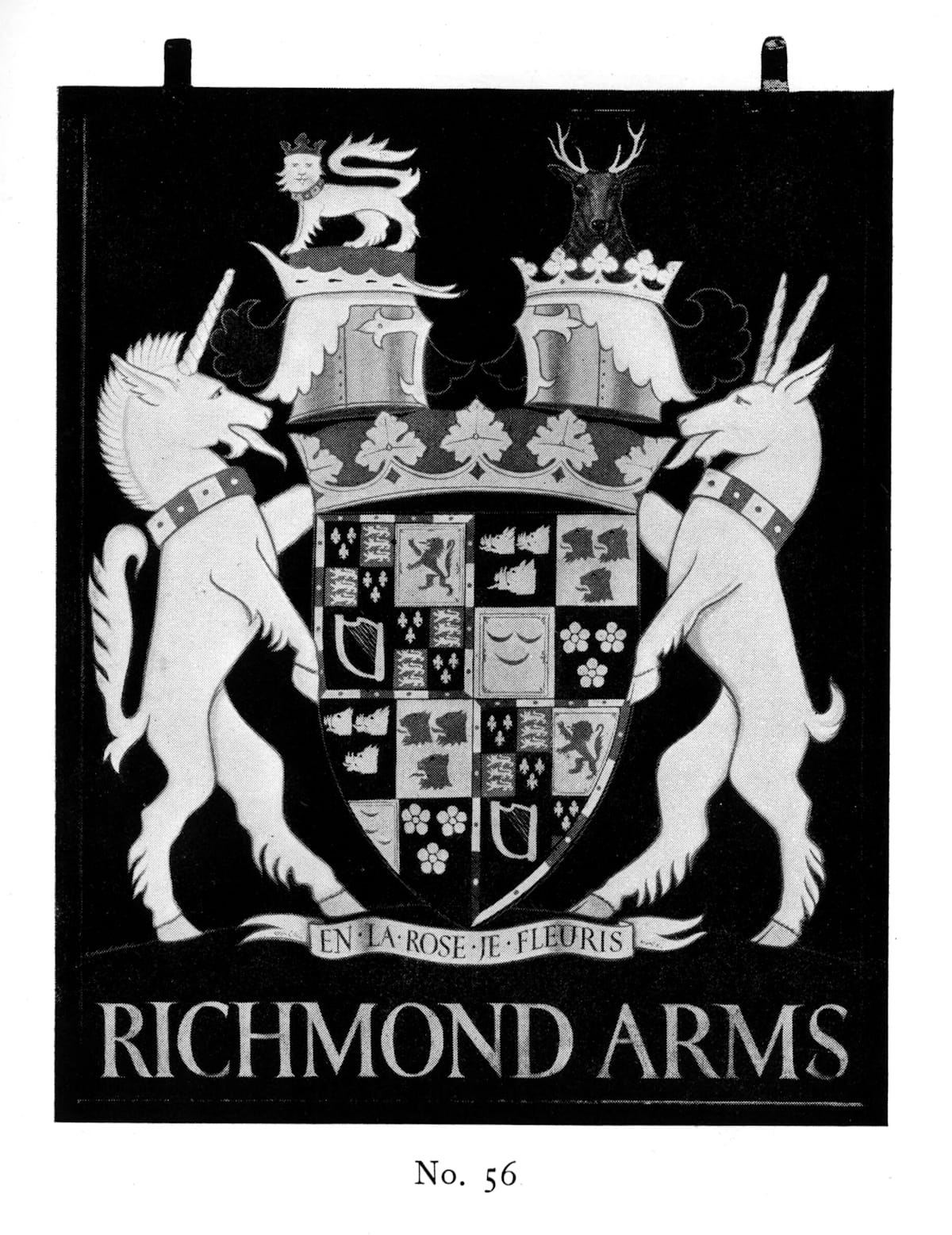 Painted inn sign with a picture of a coat of arms (shield flanked by a unicorn and two-horned animal) above lettering that says "Richmond Arms".