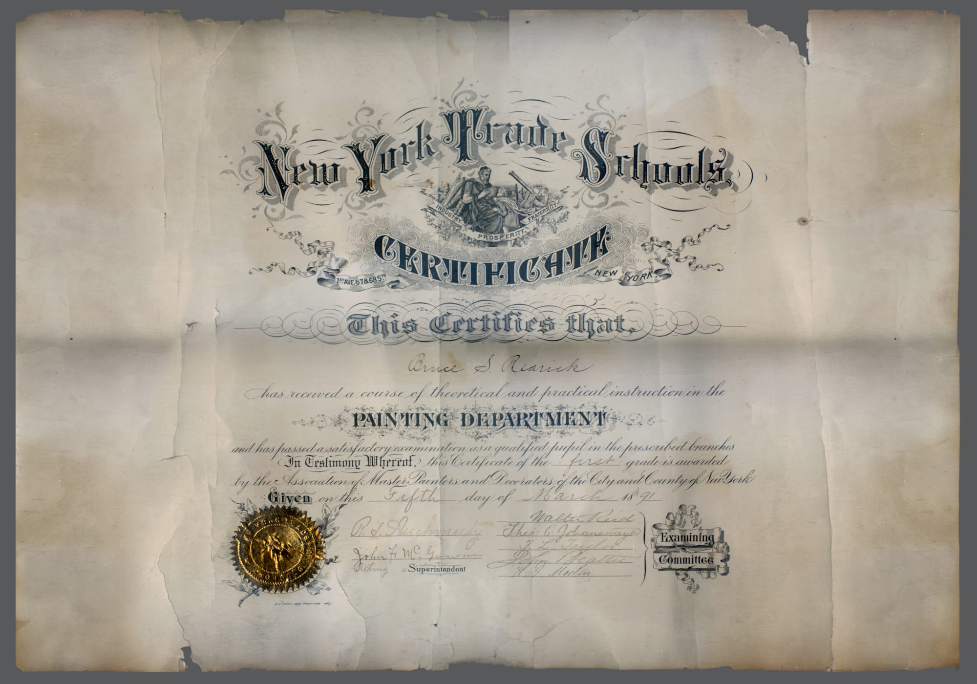 Certificate with ornate penmanship and a golden seal.