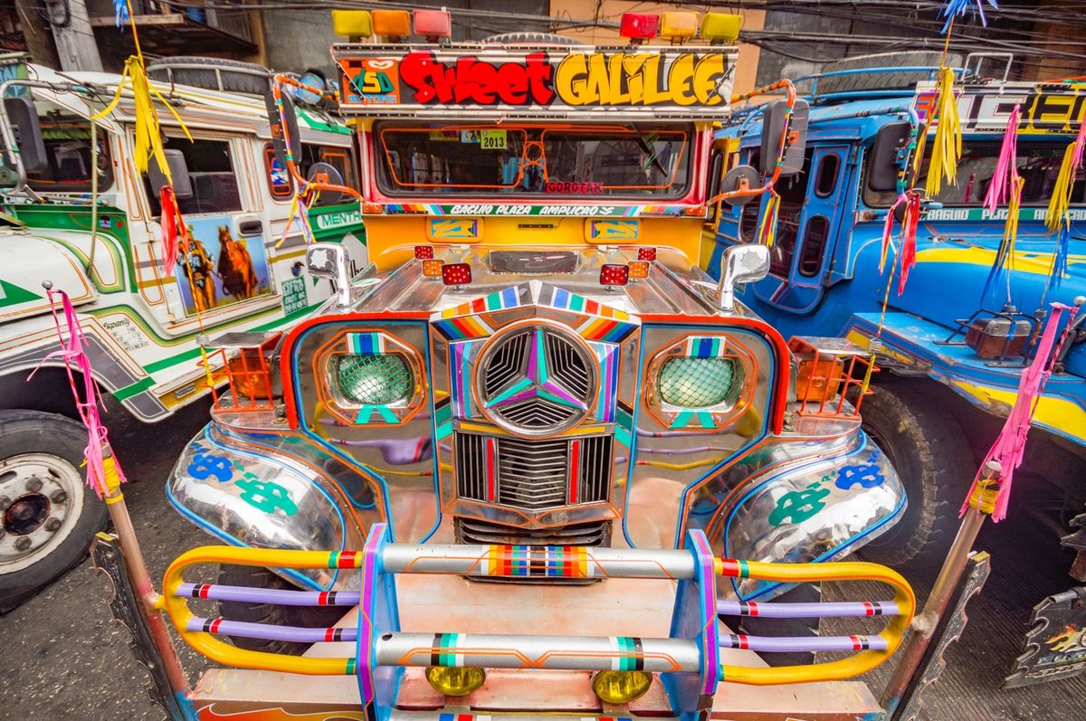 Front of a Filipino Jeepney flamboyantly decorated in bright colours.