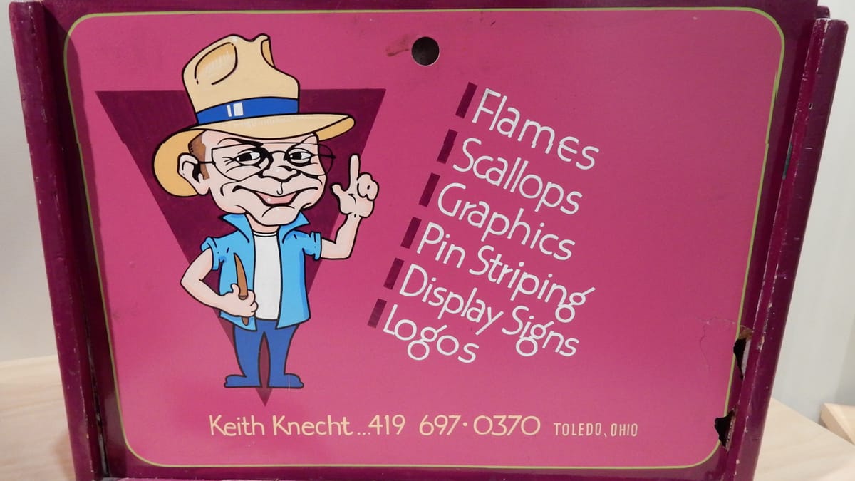 Bright pink sign kit with a cartoon sign painter, a list of services, and contact details for Keith Knecht, Toledo, Ohio.