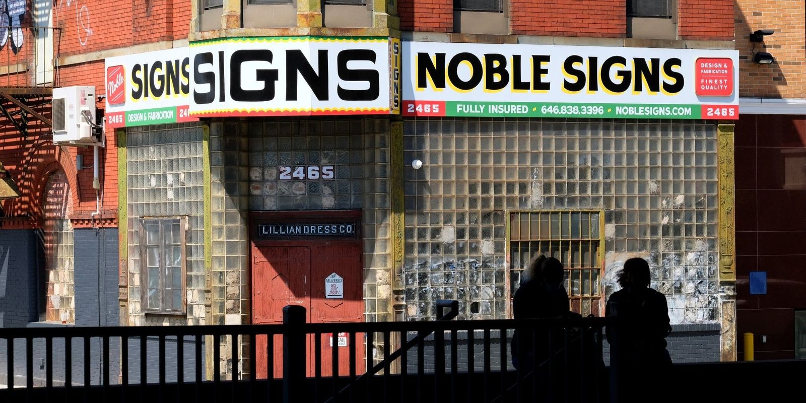Shopfront painted with 'Noble Signs'.