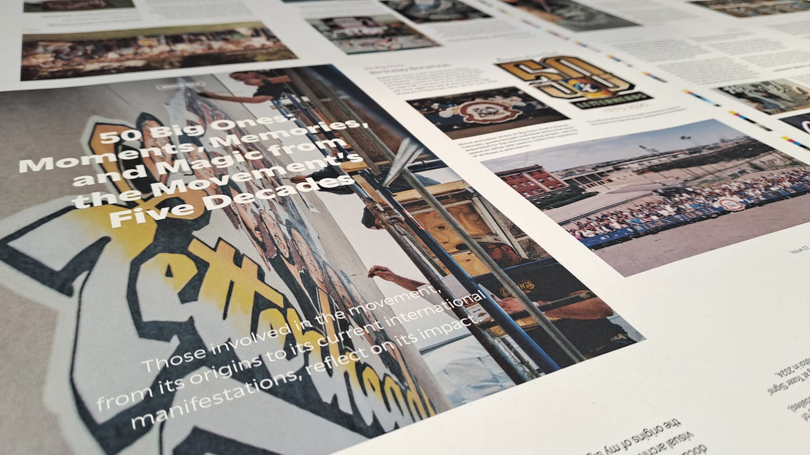 Close-up shot across a printed sheet from the production of a magazine with visible headline of "50 Big Ones: Moments, Memories, and Magic from the Movement's Five Decades".
