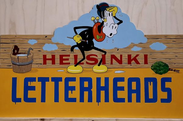Painted sign saying 'Helsinki Letterheads'.