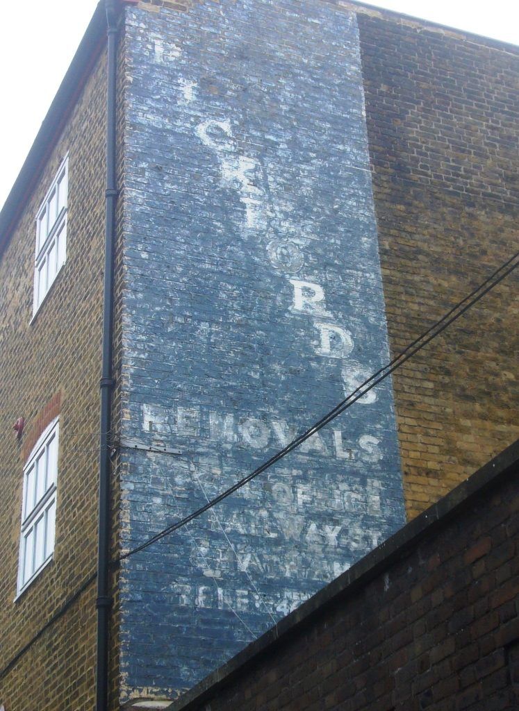 Ghostsign for Pickfords Removals in an alleyway visible from Rochester High Street.