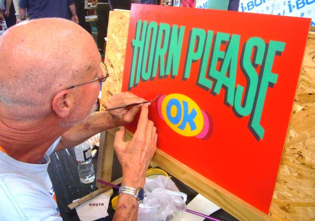 Inspired by the screening of Horn Please, Sign Painter Movie’s John Lenning gets to work on a panel for the charity auction, raising money for Arthritis Research UK.