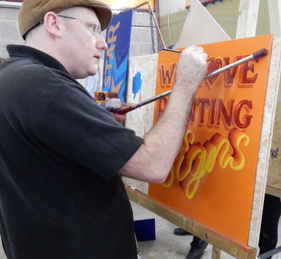 Frank Carty at work on his panel