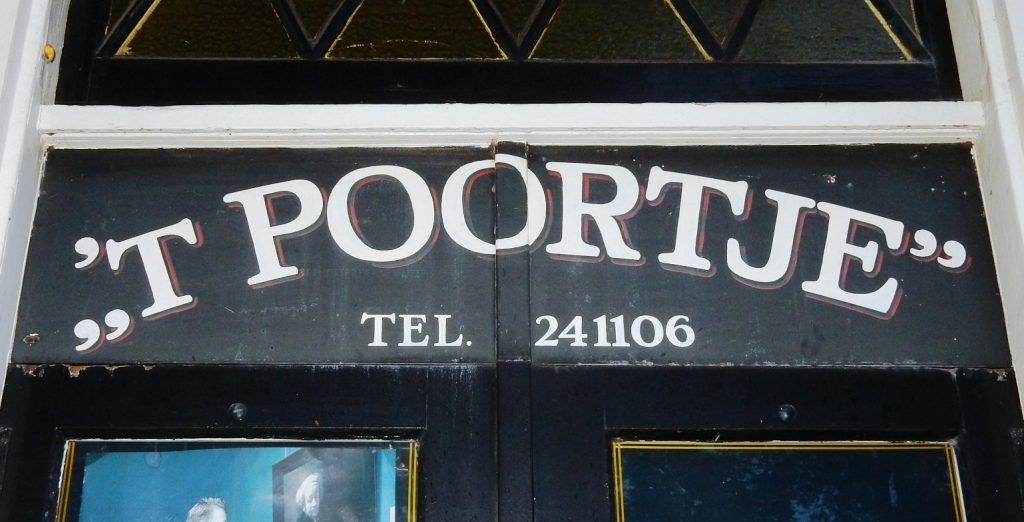 This is the fascia of a bicycle shop that also features some Amsterdam Curly Letters on the window.