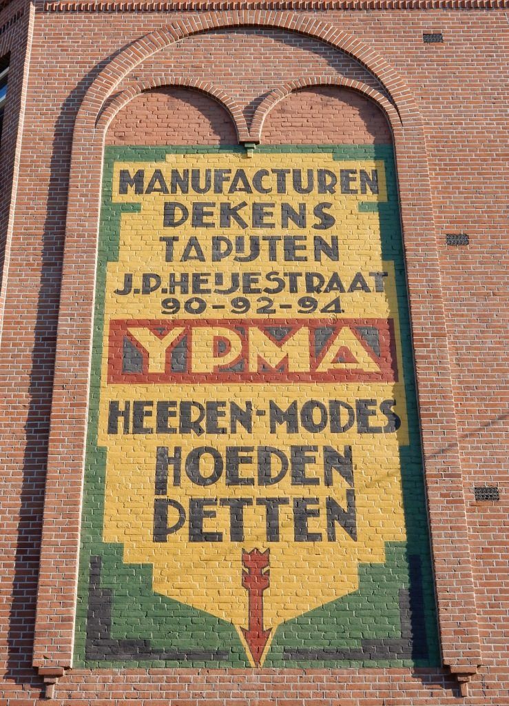 This is one of the many ghost signs in Amsterdam, and across the Netherlands, that have been repainted.