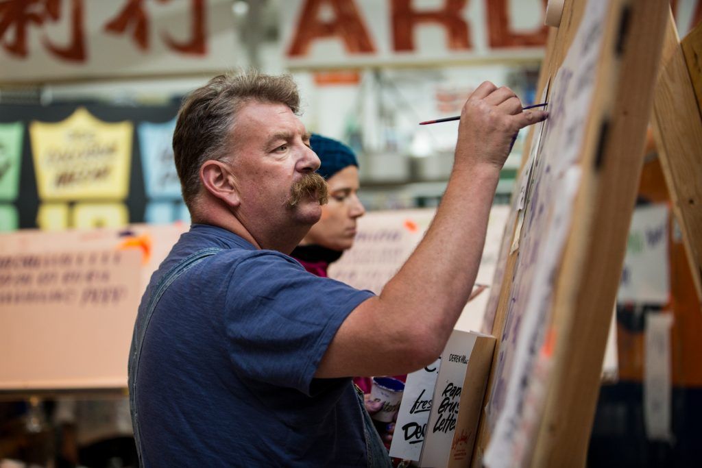 Mike Meyer on the brush at his workshop in Colossal, Brooklyn. (Photo: Christa Lindahl / Colossal Media.)