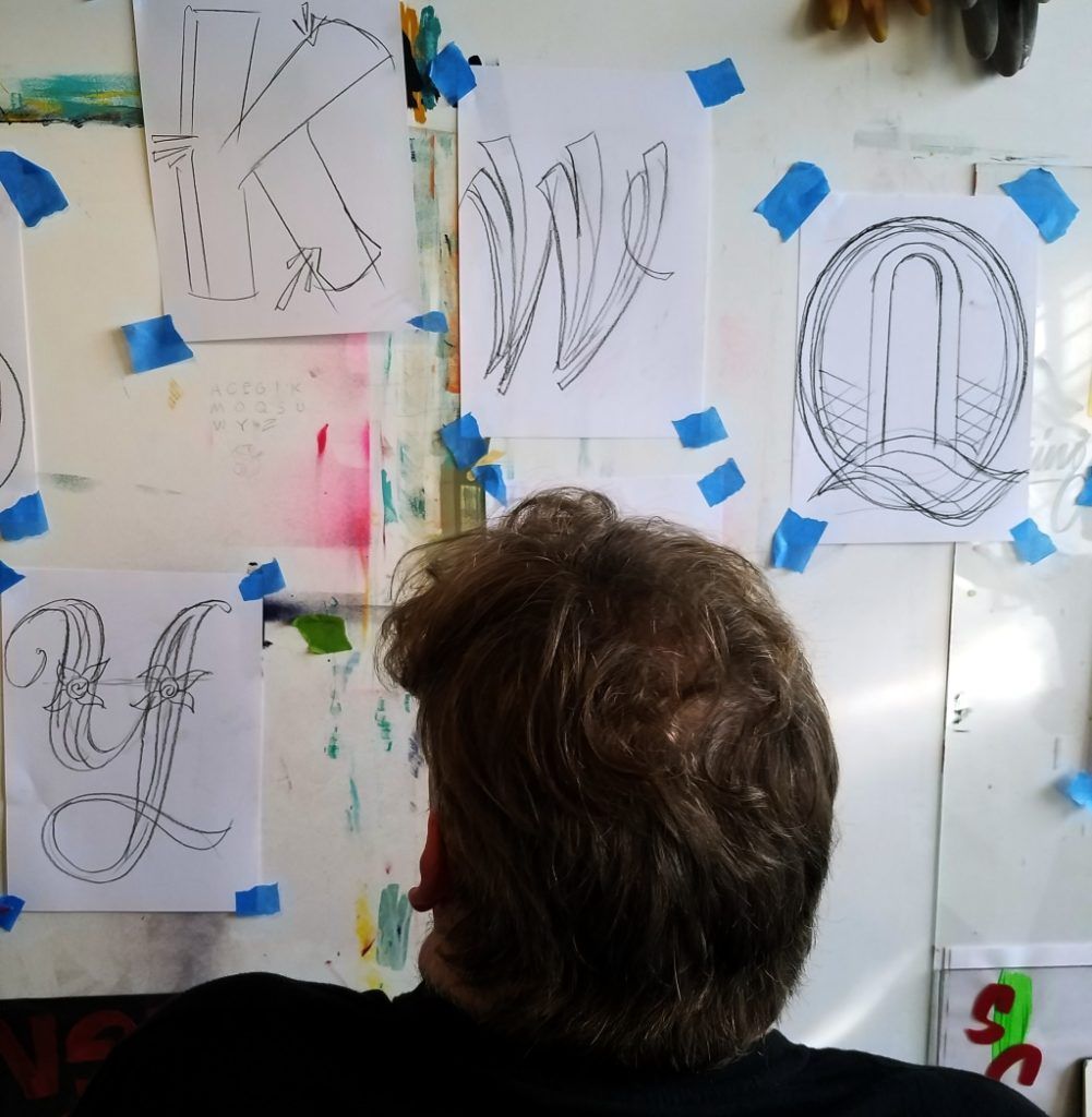 Mike Meyer, Sign Painter, with early sketches for his letters.