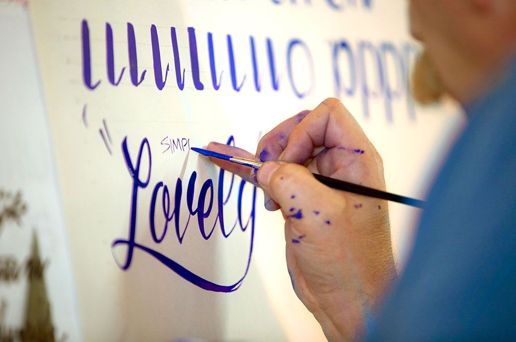 Some script and, above, a student’s practise strokes.