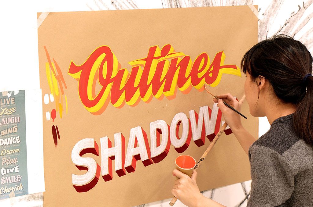 Getting started with outlines and shadows during the Lettering Effects part of the workshop. (Yes, we spelled it wrong!)