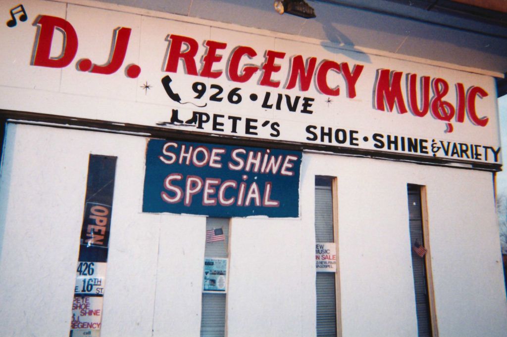 Painted signs on a shopfront.